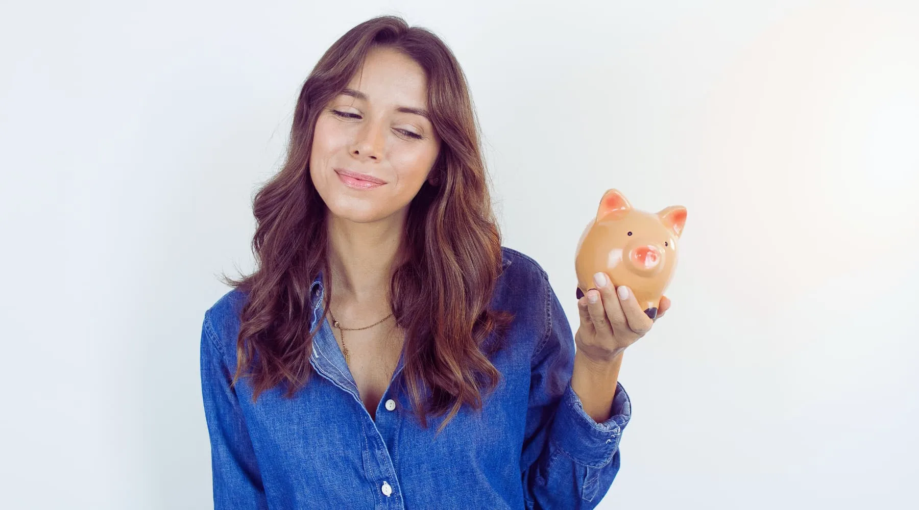 woman holding piggy bank