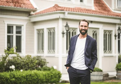 man standing outside home